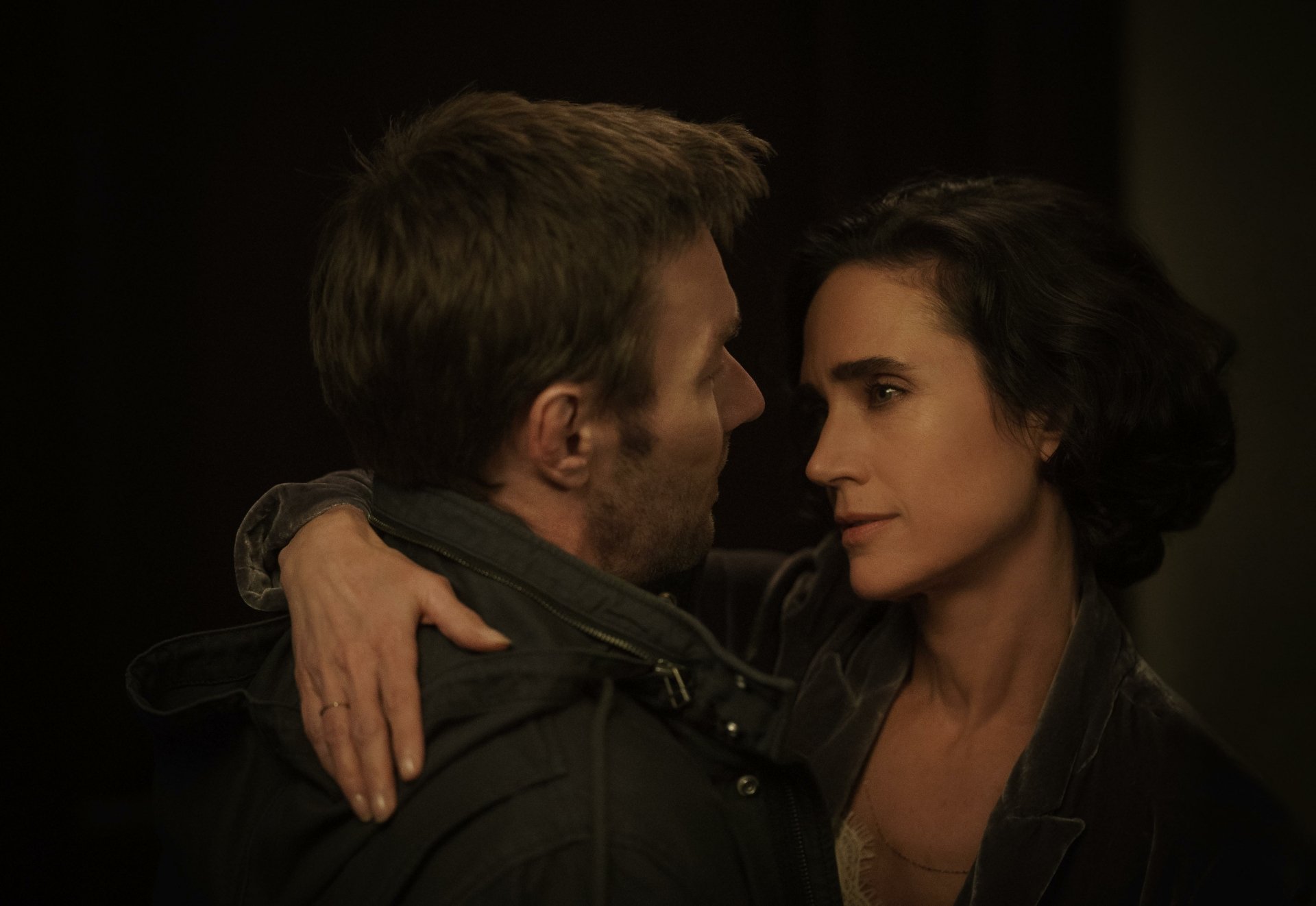 HD wallpaper of Jennifer Connelly and Joel Edgerton in a close, emotional scene from the TV show Dark Matter (2024).