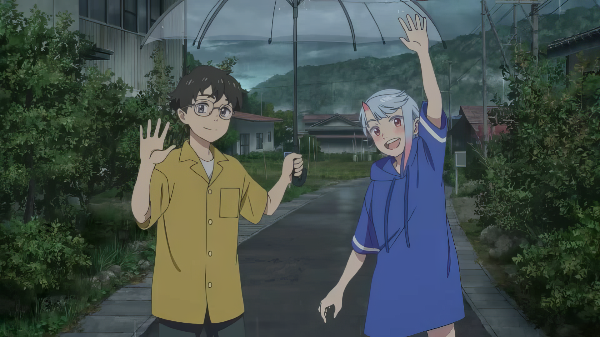 Two characters from the anime My Oni Girl wave while holding an umbrella. The HD desktop wallpaper showcases them in a countryside setting with greenery and mountains in the background.