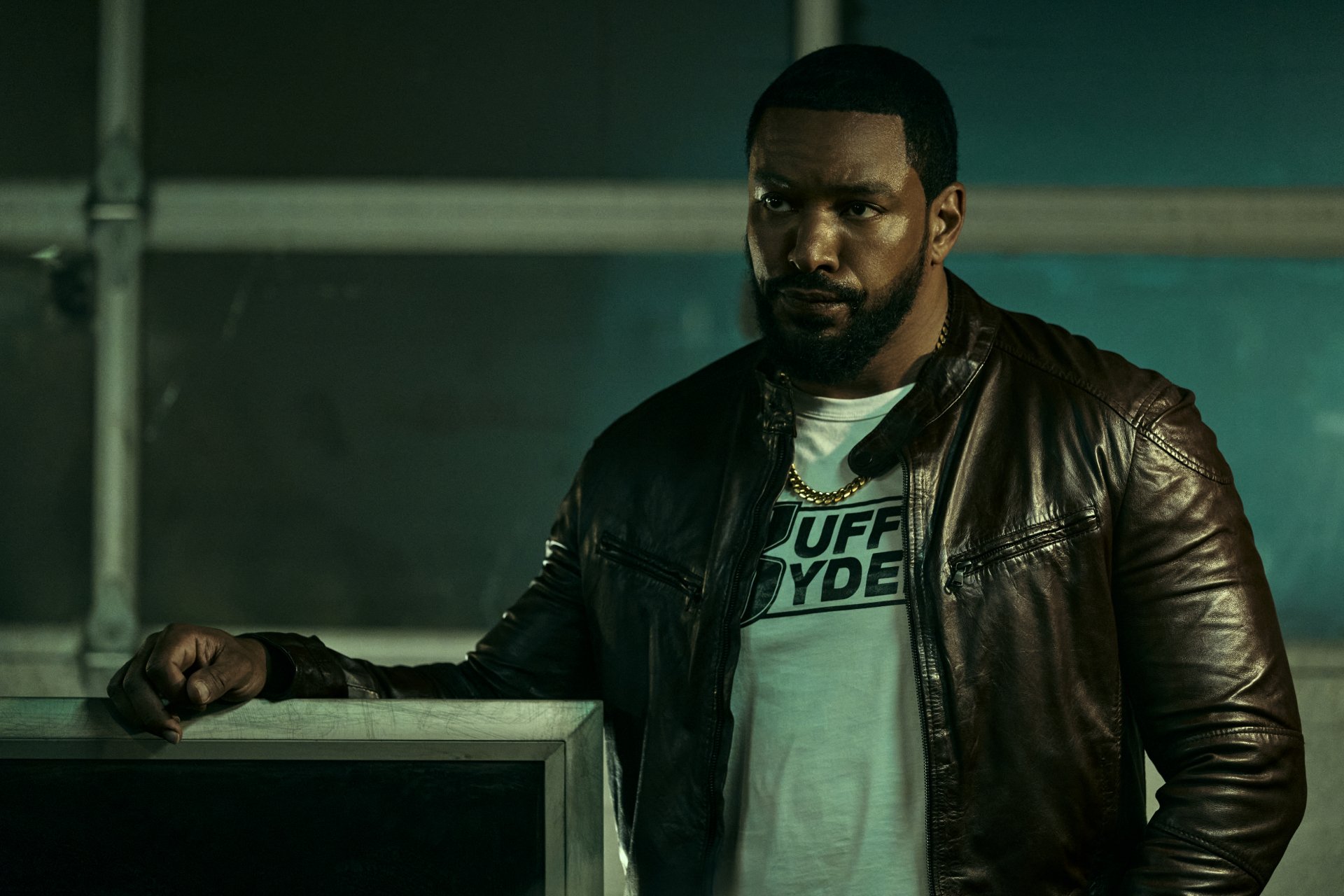 HD desktop wallpaper featuring Laz Alonso from the TV show The Boys (2019), wearing a leather jacket and standing with a serious expression.