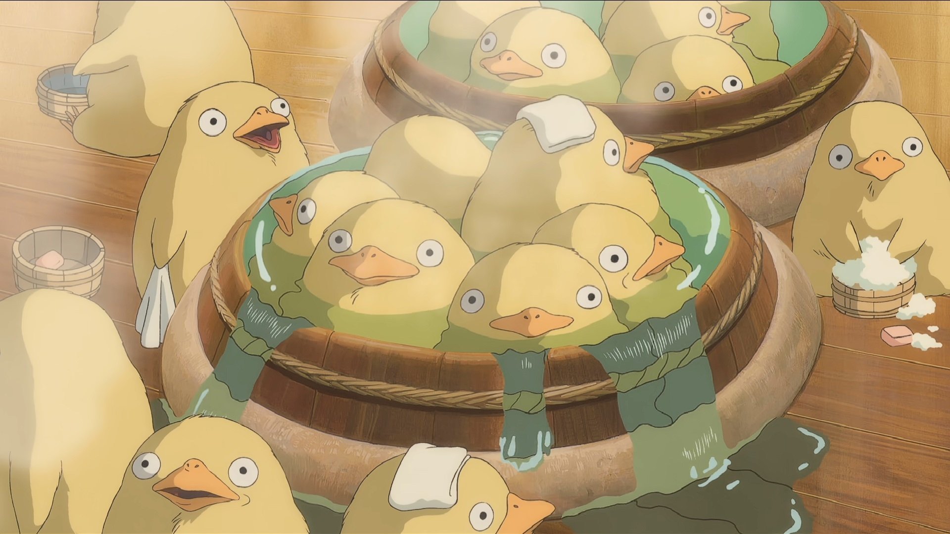 HD anime desktop wallpaper featuring Chihiro's ducklings from Studio Ghibli's Spirited Away in warm tones and detailed animation style.