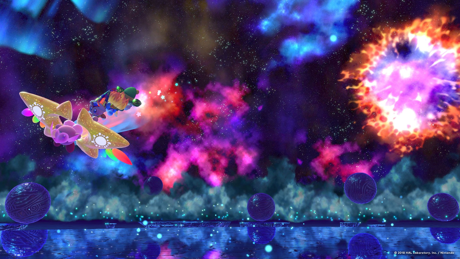 HD PC desktop wallpaper featuring Kirby and other characters flying through a vibrant, colorful cosmic space scene with stars, planets, and a glowing explosion.
