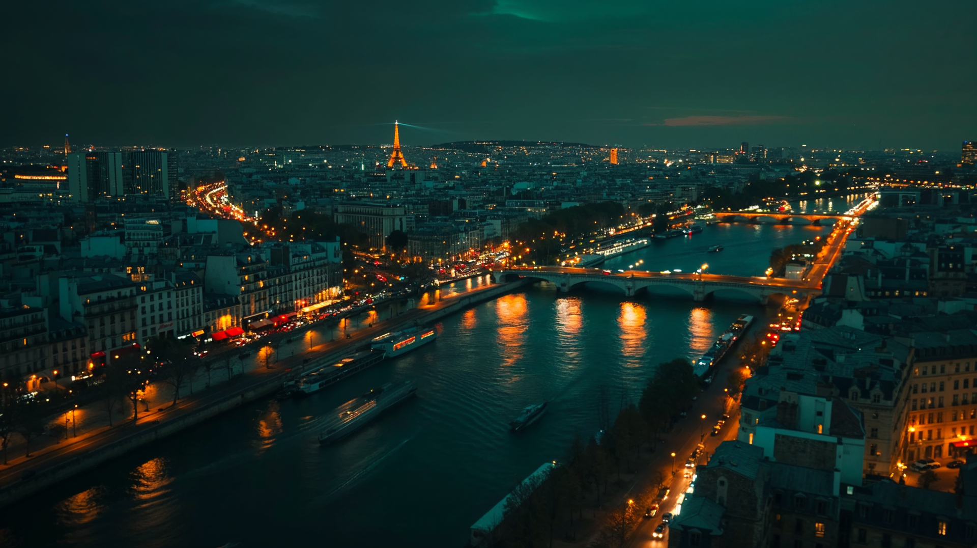 HD PC desktop wallpaper of Paris at night, featuring the illuminated Eiffel Tower and bridges over the Seine River with city lights reflecting on the water.