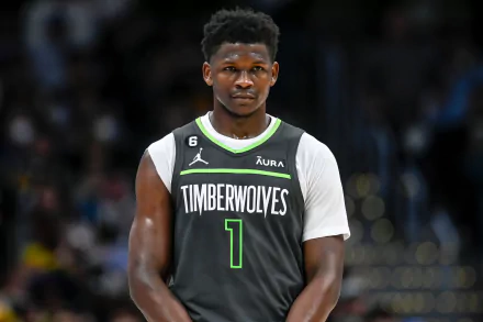 HD desktop wallpaper featuring Anthony Edwards of the Minnesota Timberwolves in his team jersey on the basketball court.