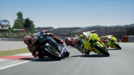HD wallpaper from MotoGP 24 video game featuring high-speed motorcycles racing on a sharp turn during a sunny day.