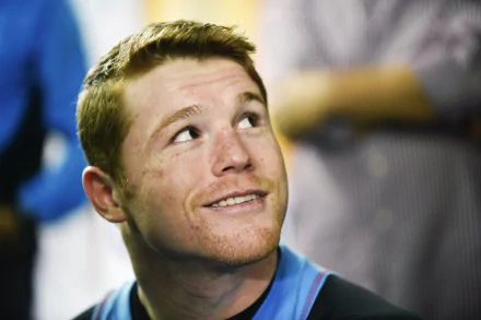 HD desktop wallpaper featuring Canelo Álvarez smiling, with a blurred background, enhancing focus on his face.