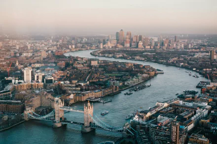 A stunning aerial view of London, showcasing the iconic Tower Bridge and the city's skyline along the River Thames. This landscape captures the vibrant essence of the United Kingdom.