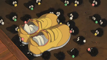 Anime HD desktop wallpaper featuring Chihiro's yellow shoes surrounded by soot sprites from Studio Ghibli's Spirited Away.