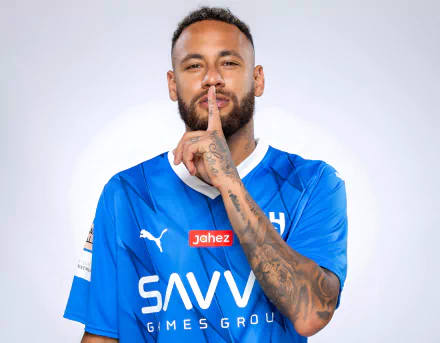 HD desktop wallpaper of soccer player Neymar wearing a blue jersey, gesturing for silence with his finger to his lips.