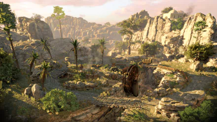 HD desktop wallpaper of Sniper Elite III depicting a rugged, sunlit landscape with rocky terrain, scattered vegetation, and strategic vantage points.