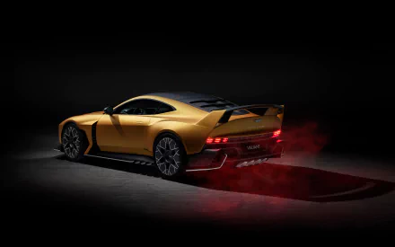 HD desktop wallpaper featuring an Aston Martin Valiant, a sleek yellow sports car with a sporty design, captured in a low light setting with red brake lights illuminating the dark background.