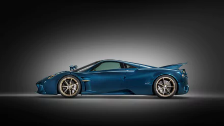 HD desktop wallpaper featuring a sleek, blue Pagani Huayra Epitome against a gradient background.