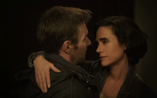 HD wallpaper of Jennifer Connelly and Joel Edgerton in a close, emotional scene from the TV show Dark Matter (2024).