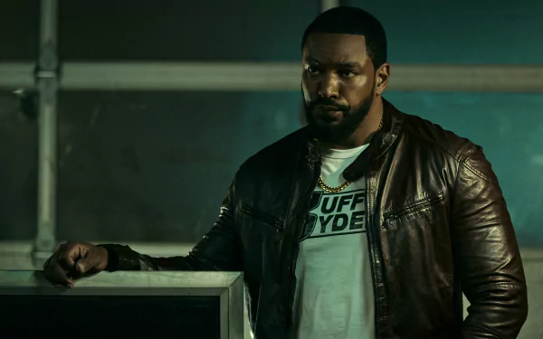 HD desktop wallpaper featuring Laz Alonso from the TV show The Boys (2019), wearing a leather jacket and standing with a serious expression.