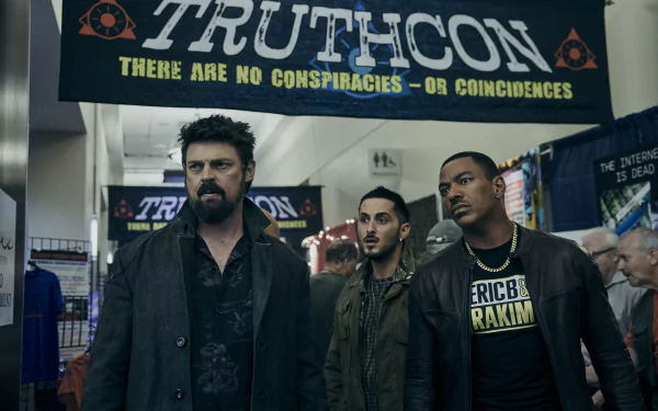 HD wallpaper featuring Karl Urban as Billy Butcher and Laz Alonso from The Boys (2019) TV show, with the characters standing under a TruthCon banner in a convention setting.