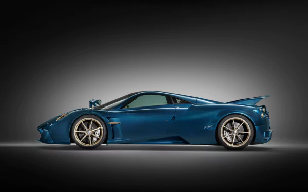 HD desktop wallpaper featuring a sleek, blue Pagani Huayra Epitome against a gradient background.