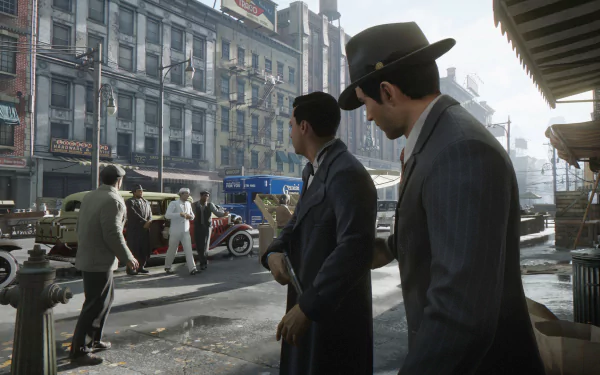 HD wallpaper of Mafia: Definitive Edition featuring men in 1930s attire on a city street, vintage cars, and historic buildings.