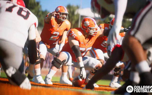 HD desktop wallpaper featuring a scene from EA Sports College Football 25, showcasing an intense moment on the field with players in action. The logo is displayed in the bottom right corner.