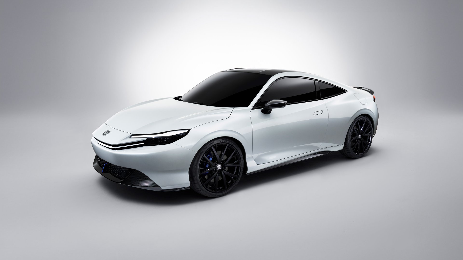 A sleek white Honda Prelude showcases its streamlined design against a minimalist background, making it a striking HD desktop wallpaper.