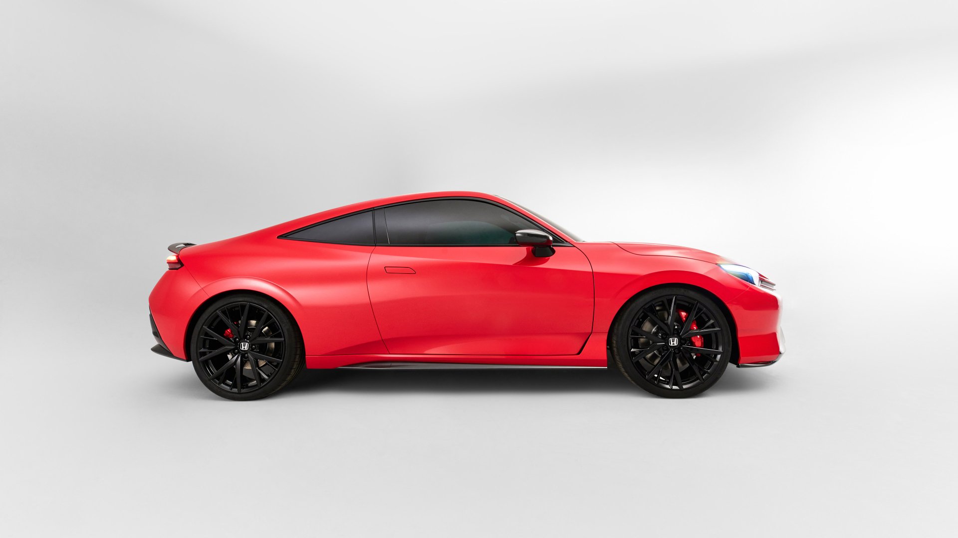 A striking red Honda Prelude showcased in a sleek profile view, set against a minimalist background, designed as a 4K Ultra HD PC desktop wallpaper.