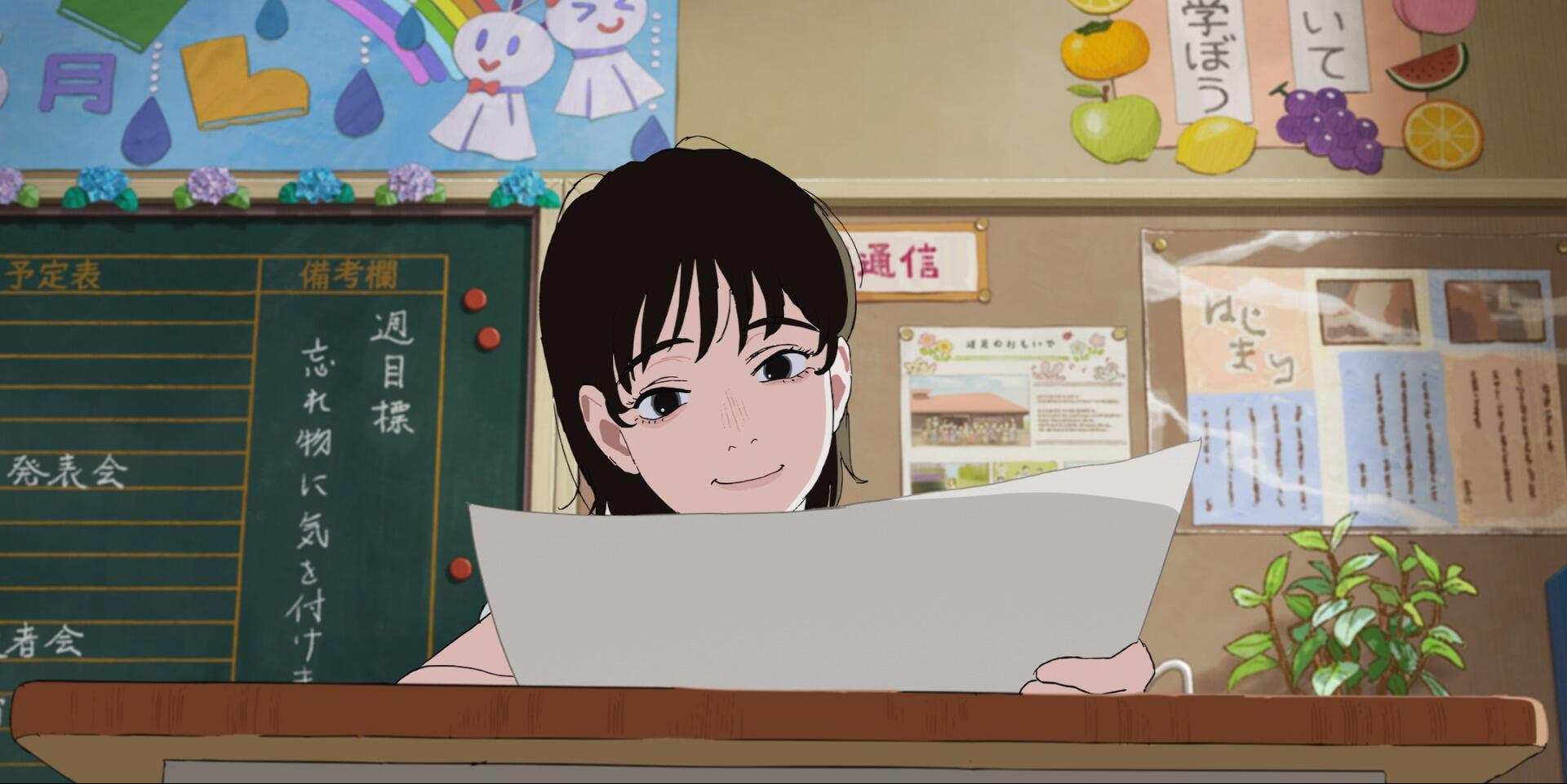 A young girl smiles while holding a paper in a cozy classroom filled with colorful decorations. This HD anime wallpaper captures a moment of joy and curiosity.