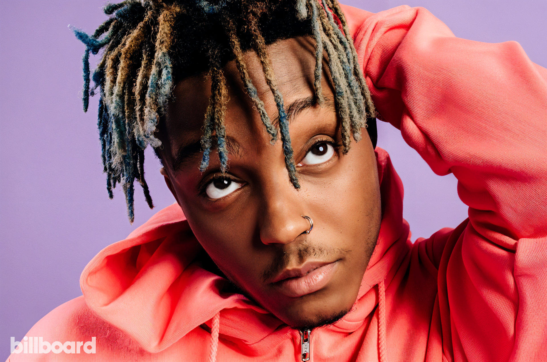 Juice Wrld, an influential rapper, is portrayed in this vibrant HD desktop wallpaper, showcasing his distinctive style and captivating expression against a colorful background.
