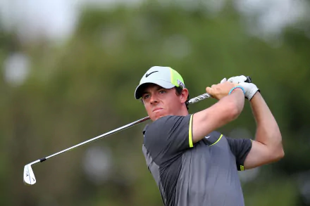 HD desktop wallpaper featuring professional golfer Rory McIlroy in a dynamic golf pose, set against a vibrant sports background.