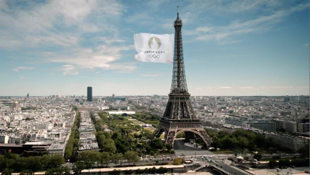 An HD desktop wallpaper featuring the Eiffel Tower, celebrating the Olympic Games Paris 2024, showcasing the vibrant spirit of sports in France.