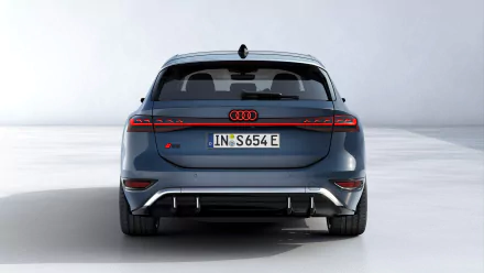 A sleek Audi S6 E-Tron showcased from the rear, featuring modern design elements and a striking color scheme, set against a clean, minimalist background. HD desktop wallpaper.