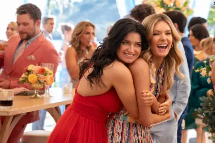 Eve Hewson and Meghann Fahy share a joyful moment together at a lively gathering in this HD wallpaper from the TV show The Perfect Couple.