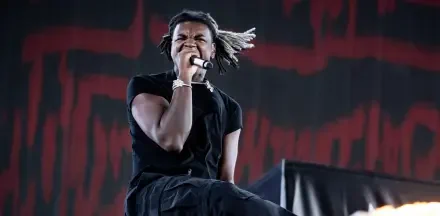 High-definition desktop wallpaper featuring Ken Carson, a prominent rapper, showcasing a dynamic and stylish aesthetic related to music.