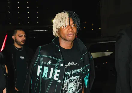 HD PC desktop wallpaper featuring rapper Ken Carson during a nighttime urban scene, blending music vibes with modern street style.