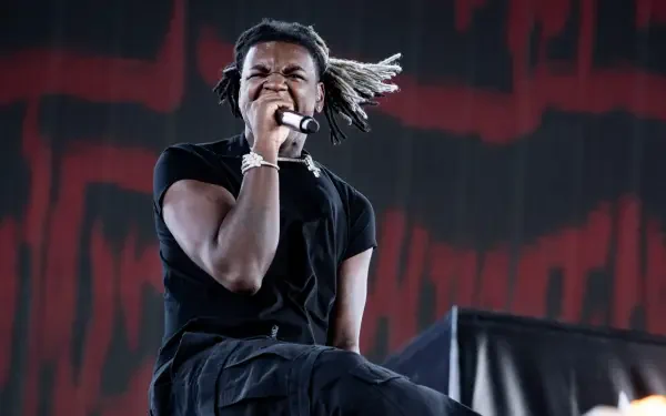 High-definition desktop wallpaper featuring Ken Carson, a prominent rapper, showcasing a dynamic and stylish aesthetic related to music.