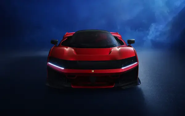 Front view of a red Ferrari F80 sports car against a smoky blue background, captured in 4K Ultra HD for a PC desktop wallpaper.
