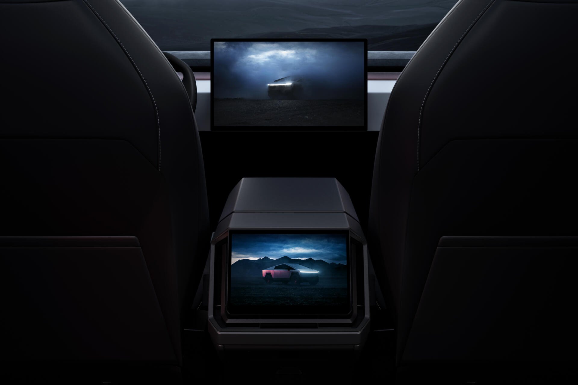 Interior view of a Tesla Cybertruck showcasing its sleek design and advanced screens, set against a dramatic backdrop. This 4K Ultra HD image serves as a striking desktop wallpaper.