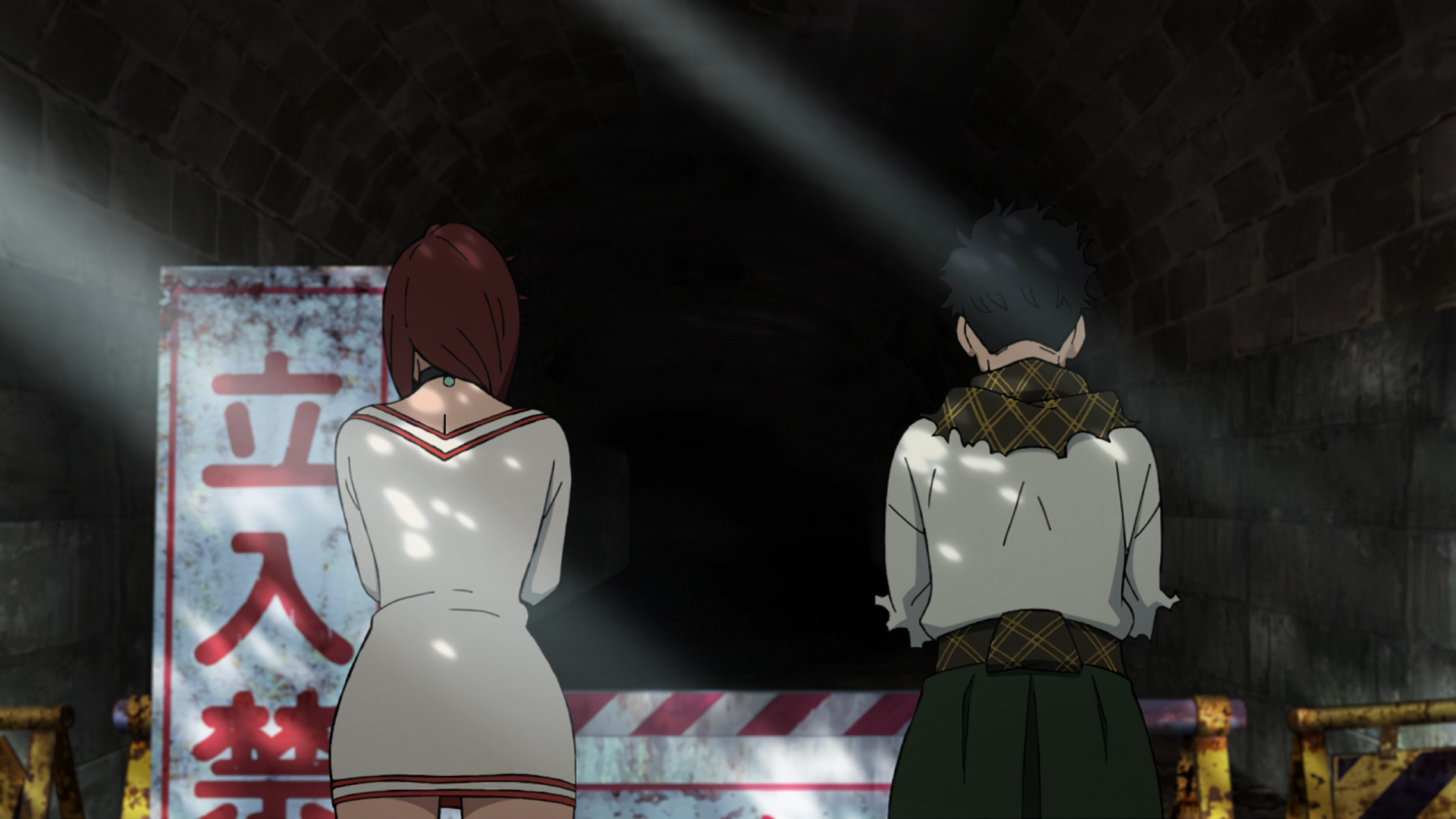 A striking HD wallpaper from the anime Dandadan, featuring characters Momo Ayase and Ken Takakura, standing together in front of a dark entrance, illuminated by soft light rays.