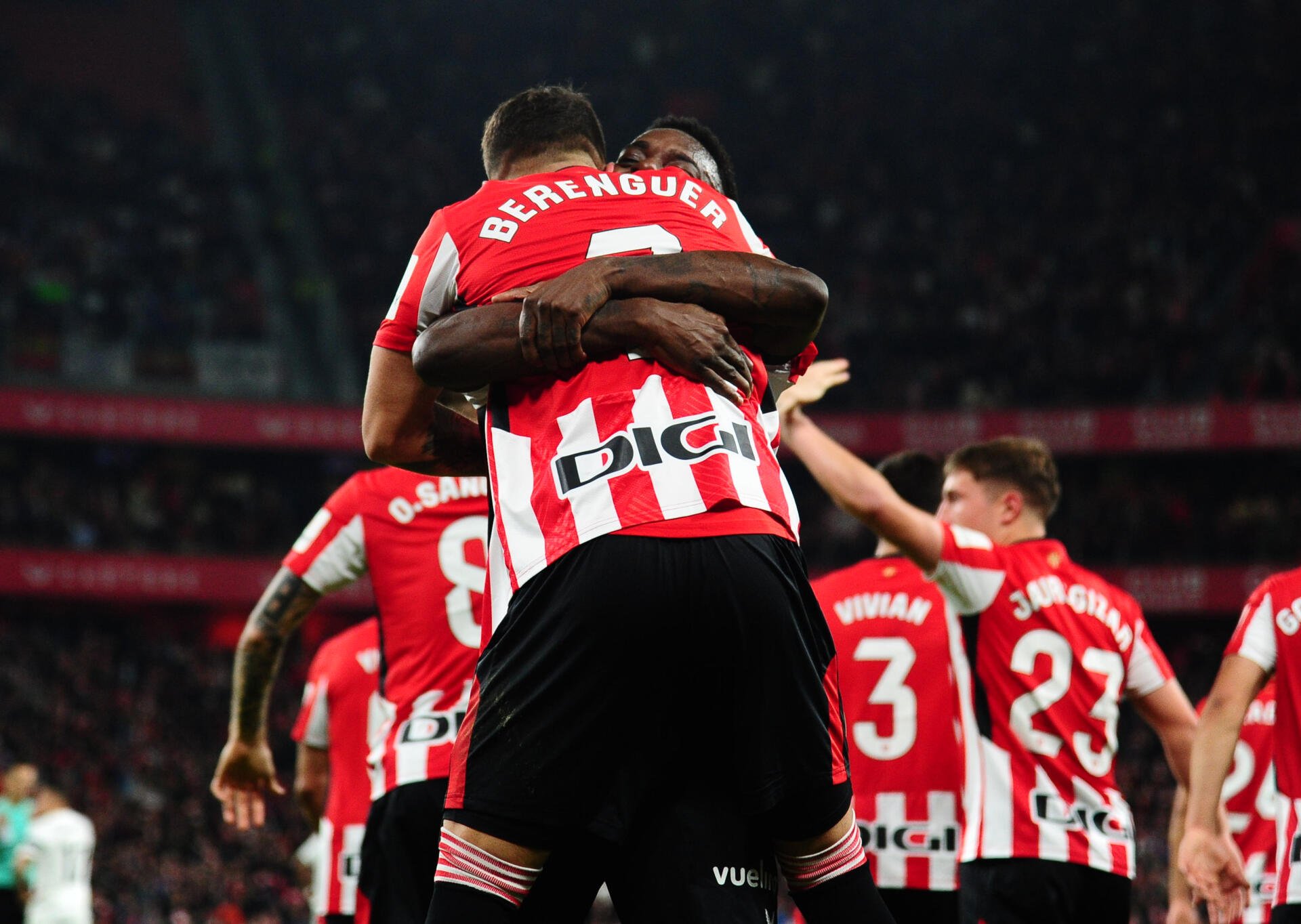 Athletic Club players celebrate a goal in a vibrant soccer moment, showcasing team spirit and athleticism. This dynamic HD wallpaper captures the excitement of the sport.