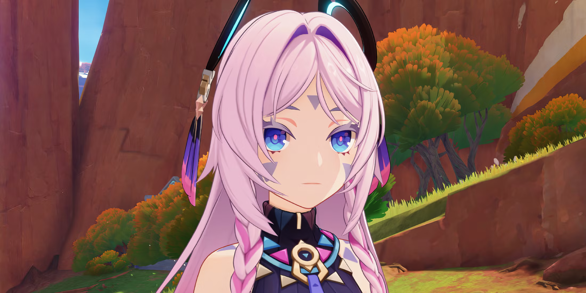 A captivating HD desktop wallpaper featuring Citlali from Genshin Impact, showcasing her striking pink hair and vibrant blue eyes against a scenic background.