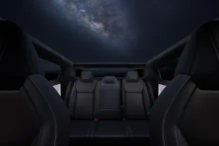 A sleek interior view of a Tesla Cybertruck, showcasing stylish black seating against a striking cosmic backdrop. This 4K Ultra HD image serves as a stunning desktop wallpaper.