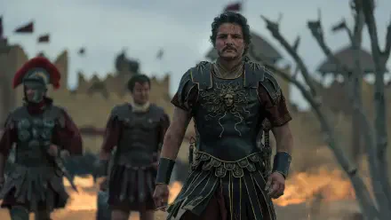 A striking 4K Ultra HD wallpaper from Gladiator II featuring Pedro Pascal in detailed armor, with soldiers in the background, set against a dramatic battlefield scene.