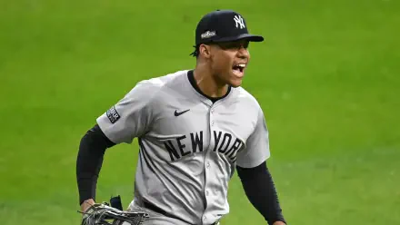 Juan Soto celebrates on the field wearing a New York Yankees uniform. This HD PC desktop wallpaper captures the excitement of MLB baseball.