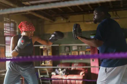 Action-packed scene from the movie The Fire Inside, featuring Ryan Destiny in a boxing training session. 4K Ultra HD desktop wallpaper showcasing determination and grit.