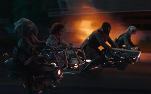 A dynamic scene from Star Wars: Skeleton Crew, featuring characters racing on futuristic bikes against a backdrop of flames, set in a vibrant 4K Ultra HD wallpaper.