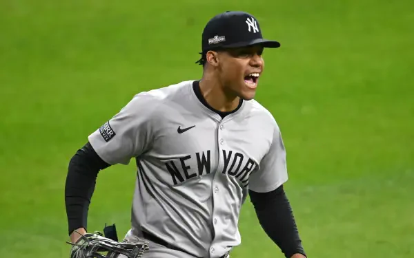 Juan Soto celebrates on the field wearing a New York Yankees uniform. This HD PC desktop wallpaper captures the excitement of MLB baseball.