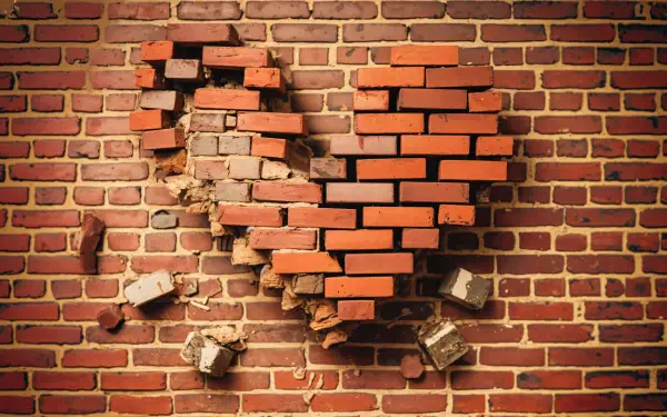 A striking 4K Ultra HD wallpaper featuring a heart-shaped break in a brick wall, symbolizing love and celebration, making it a unique background for an anniversary theme.