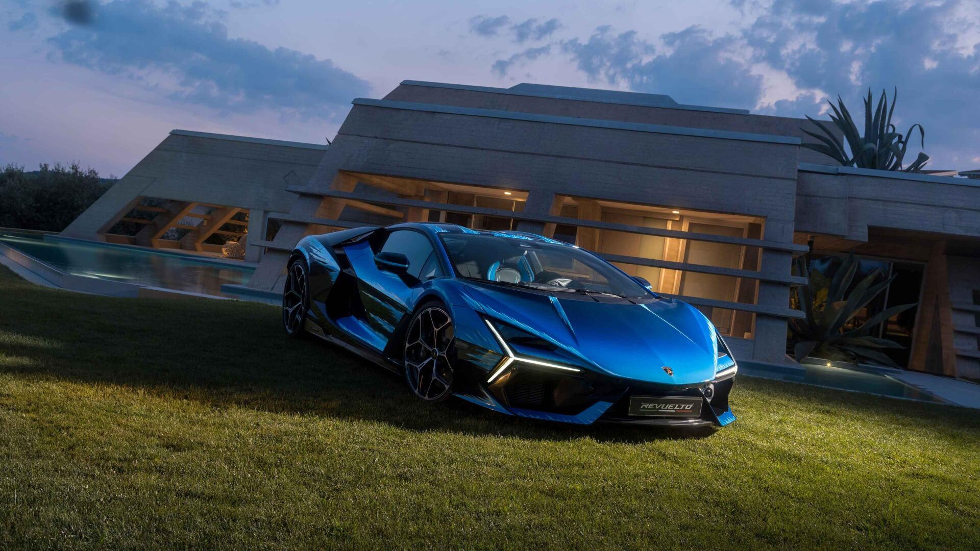 Blue Lamborghini sports car parked on grass in front of a modern house at dusk — 4K Ultra HD PC desktop wallpaper/background.