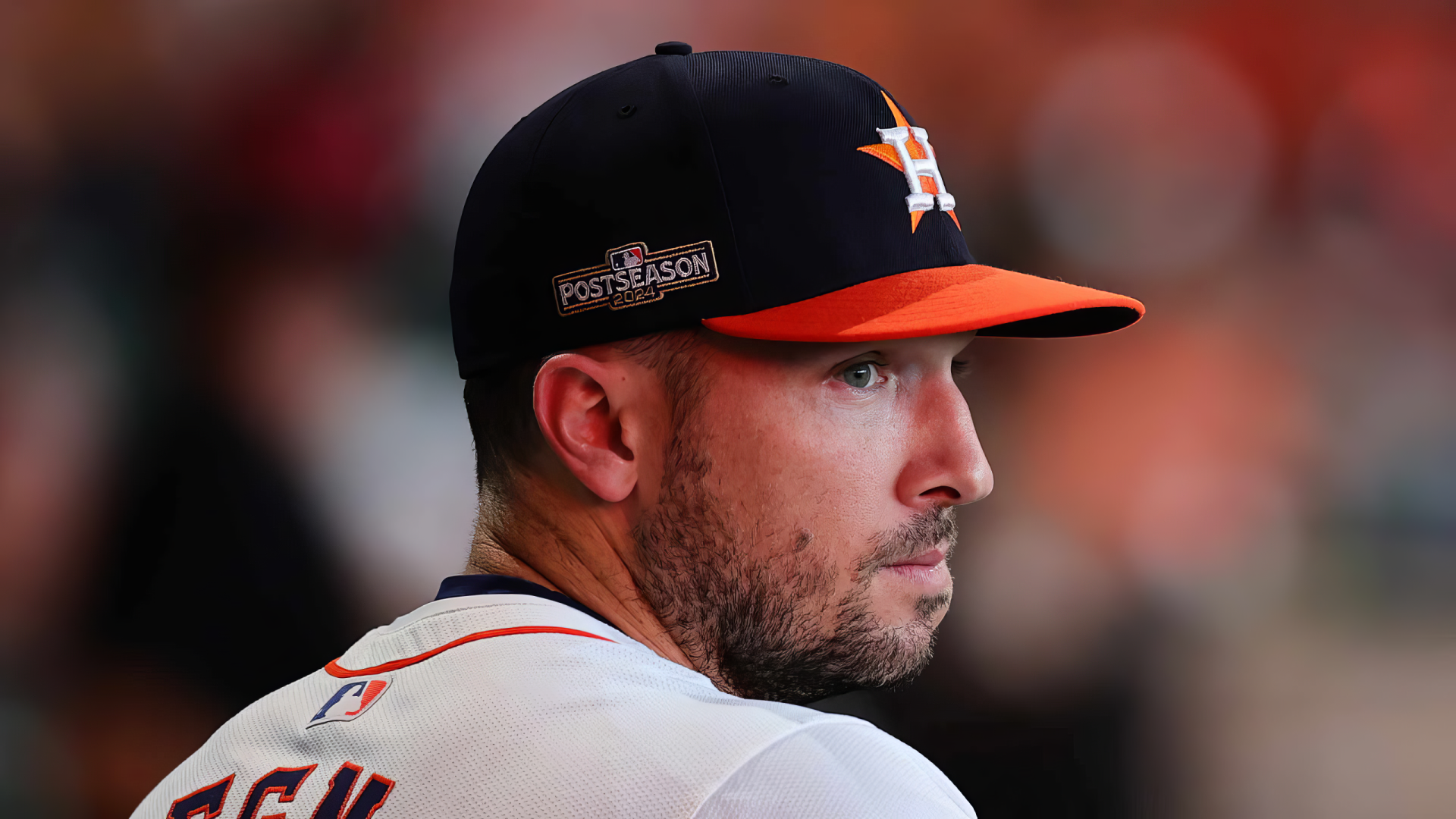 Alex Bregman of the Houston Astros gazes thoughtfully during an MLB game. The image captures his intensity and focus, making for a striking HD desktop wallpaper.