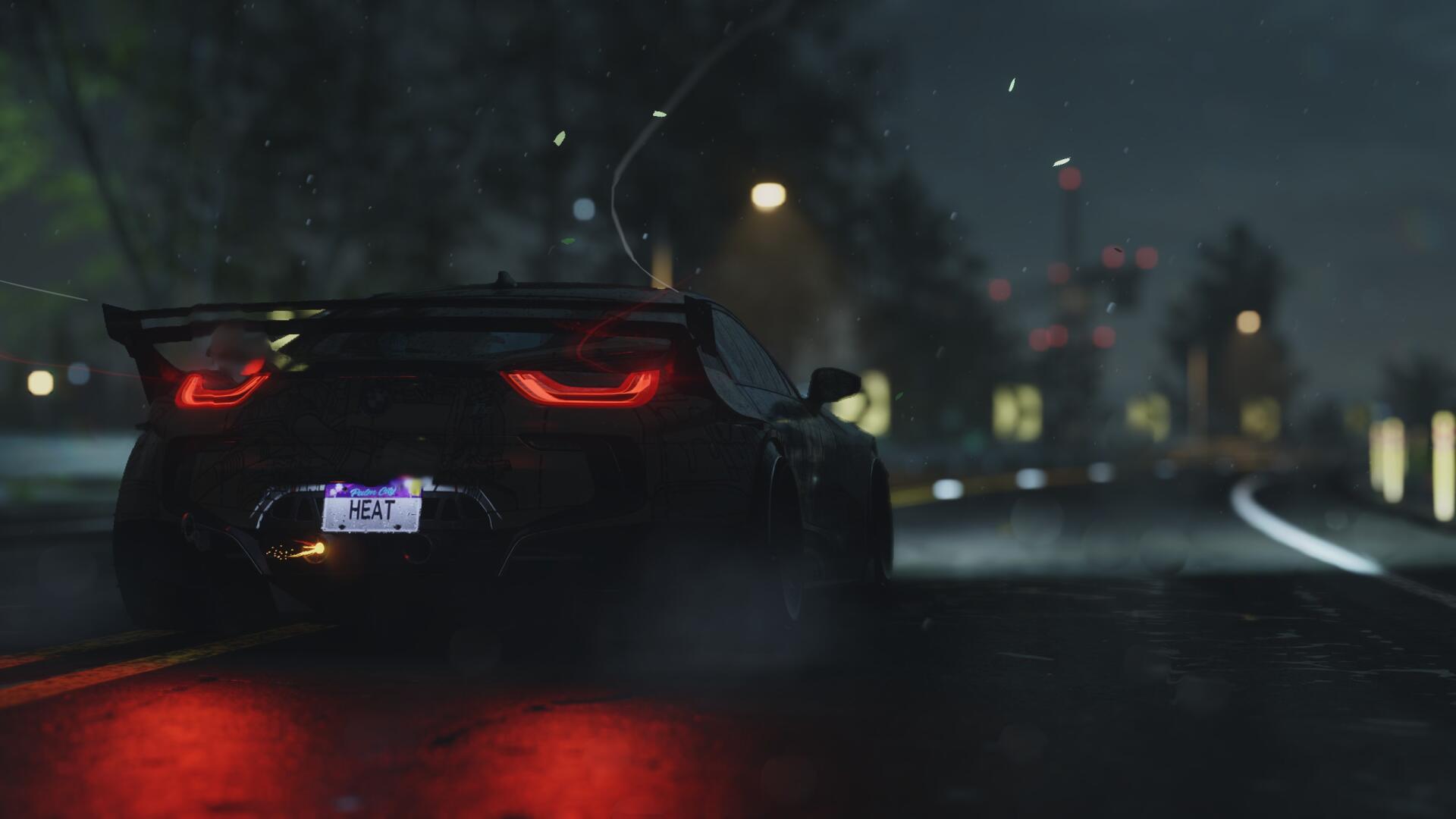 A sleek, high-definition wallpaper featuring a modified car on a rain-soaked street, capturing the thrilling essence of Need For Speed in a vibrant, atmospheric setting.