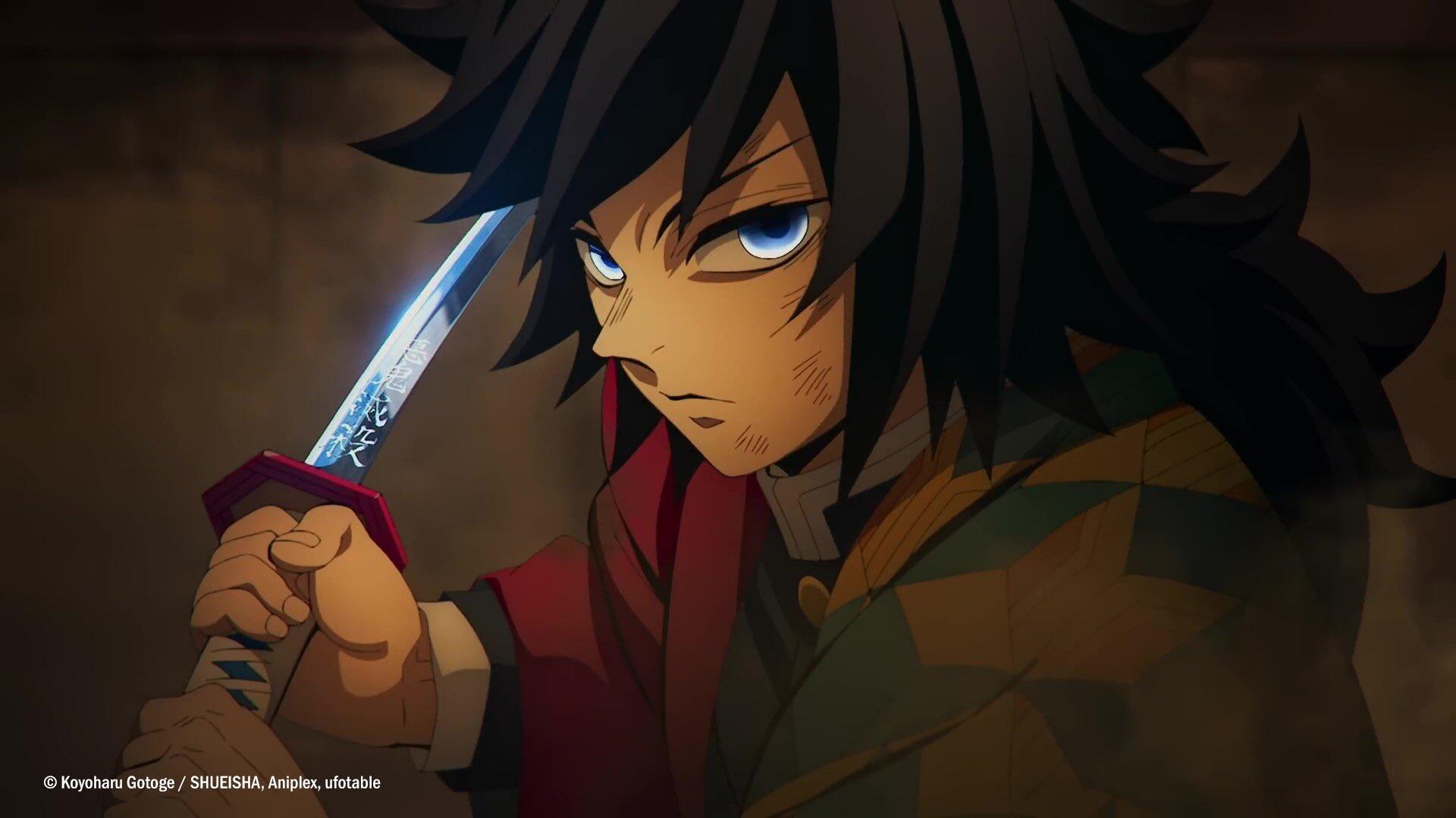 HD PC wallpaper of Giyuu Tomioka from Demon Slayer: Kimetsu no Yaiba — anime close-up, gripping a sword with intense blue eyes against a moody, shadowed background.