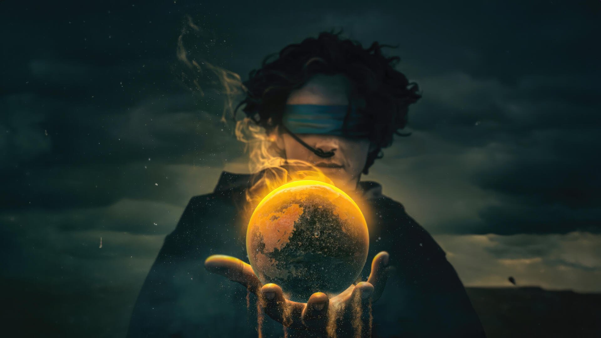 Dune: Part Three 4K Ultra HD PC desktop wallpaper — silhouetted figure cradles a glowing sand-covered planet above outstretched hands under a stormy sky.