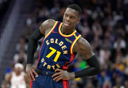 Dennis Schröder of the Golden State Warriors poses confidently in his NBA jersey during a game. This high-definition image captures the dynamic energy of basketball.
